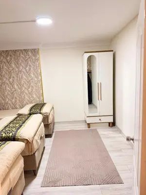 a hotel room with two beds and a mirror at Luxury Apartment In A Great Location 10 in Istanbul