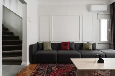 a living room with a couch and a table at Premium Family House for 10 Near Taksim in Istanbul