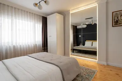a bedroom with a large bed and a mirror at Premium Family House for 10 Near Taksim in Istanbul