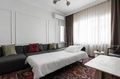 a living room with a couch and a table at Premium Family House for 10 Near Taksim in Istanbul