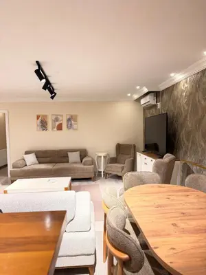 a living room with a couch and a table at Great Location Terrace Apartment 15 in Istanbul