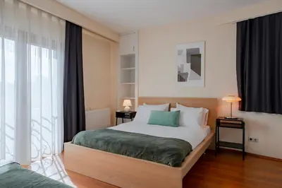 a bedroom with a bed and a large window at Spacious 1-Bedroom Apartment with Bosphorus View in Istanbul