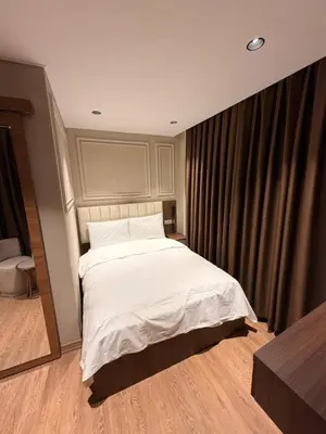 a bedroom with a white bed and a window at city istiklal in Istanbul