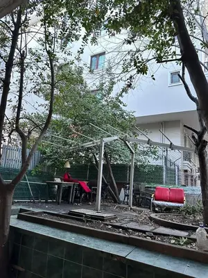 a backyard with a picnic table and chairs and trees at Twin Double X2 Room in Istanbul