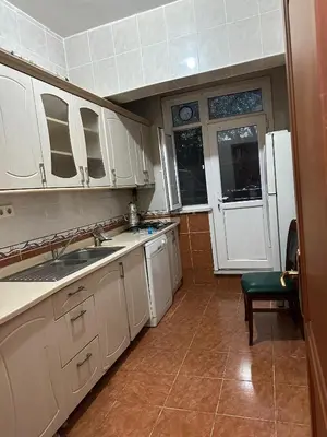 a kitchen with white cabinets and a sink at Twin Double X2 Room in Istanbul