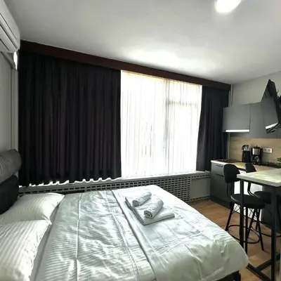 a hotel room with a bed with two towels on it at Accommodation Near the Bull Statue in Kadikoy in Istanbul