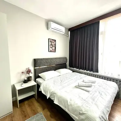 a bedroom with a bed and a window at Accommodation Near the Bull Statue in Kadikoy in Istanbul