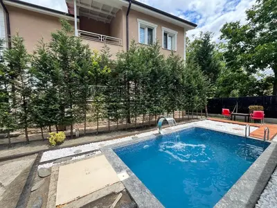 a swimming pool in front of a house at Mansion with private pool in Sapanca in Sapanca