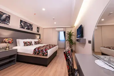a hotel room with a bed and a bathroom at Bond Hotel in Istanbul