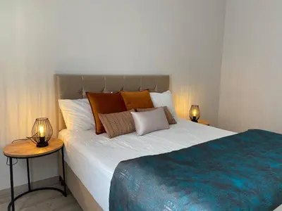 a bedroom with a large bed with pillows on it at Breathtaking view apartment in Istanbul