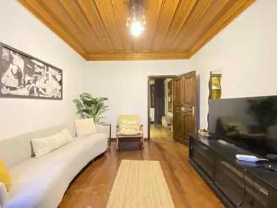 a living room with a couch and a flat screen tv at Historic Lütfi Pasha House in Balat 2BR in Istanbul