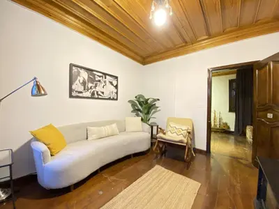 a living room with a couch and a chair at Historic Lütfi Pasha House in Balat 2BR in Istanbul