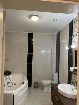 a bathroom with a tub and a toilet and a sink at Legend Tem Hotel in Silivri