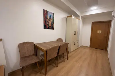 a dining room with a table and two chairs at VALENCE SUITES Taksim in Istanbul