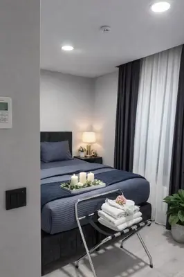 a bedroom with a bed and a table with candles at Signature Suites in Taksim in Istanbul
