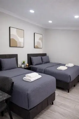 a room with two beds and a couch at Signature Suites in Taksim in Istanbul