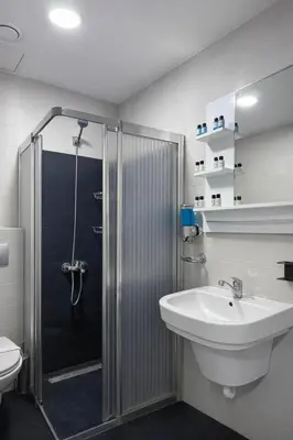 a bathroom with a shower and a sink and a toilet at Signature Suites in Taksim in Istanbul