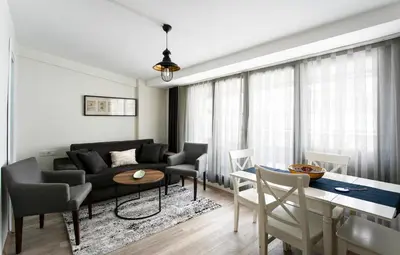 a living room with a couch and a table at Happy Homes & Apartments Taksim in Istanbul
