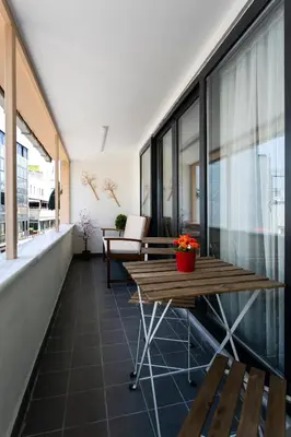 a balcony with a table and chairs on a building at Happy Homes & Apartments Taksim in Istanbul