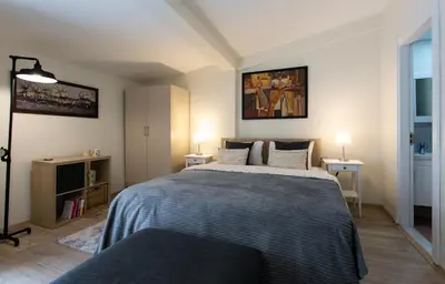 a bedroom with a bed with a blue blanket at Happy Homes & Apartments Taksim in Istanbul