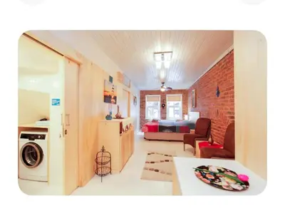 a living room with a kitchen and a bedroom at Two seperate apartments for friends and families in Istanbul