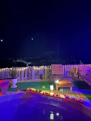 a view of a pool at night with lights at Sakaryabungalow in Geyve