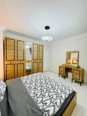 a bedroom with a large bed and a desk at ekinci cihangir in Istanbul