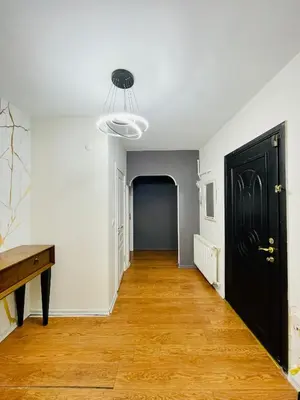 an empty room with a hallway with a black door at ekinci cihangir in Istanbul