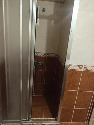 a shower with a glass door in a bathroom at otel efendi in Istanbul