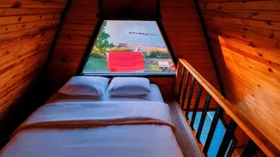 a bed in a room with a window at Regulus Sapanca in Sapanca