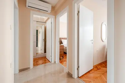 an open hallway with white walls and wood floors at Samuray in Istanbul