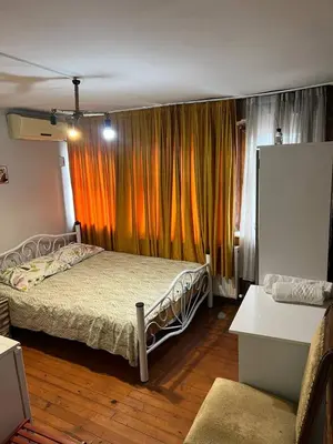 a bedroom with a bed in front of a window at suite near Taksim square in Istanbul