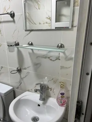 a bathroom with a sink and a mirror at suite near Taksim square in Istanbul