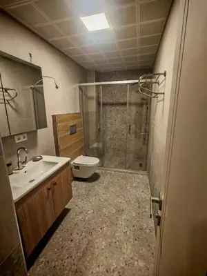 a bathroom with a shower and a sink and a toilet at Suitev in Arnavutköy