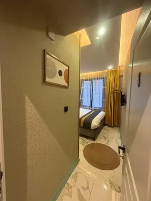 a room with a bedroom with a bed and a window at Warm cozy studio 8 min by metro station in Istanbul