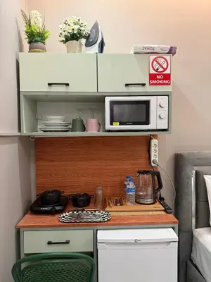 a kitchen with a counter top with a microwave at cozy studio apt near to taksim square in Istanbul