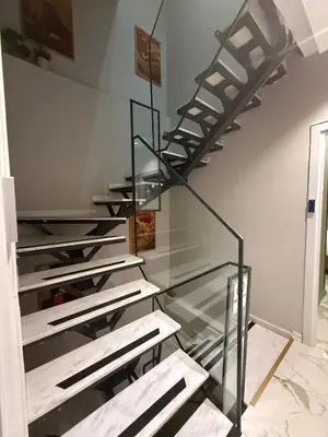 a staircase in a room with a glass floor at cozy studio apt near to taksim square in Istanbul