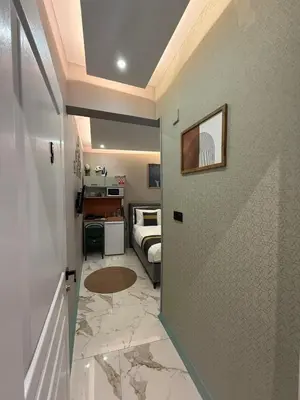 a room with a door leading to a bedroom at cozy studio apt near to taksim square in Istanbul