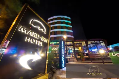 a hotel sign in front of a building at night at Mard-inn Hotel in Istanbul
