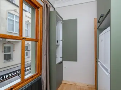 a room with a window and a walk in closet at acme studio in Istanbul