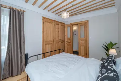 a bedroom with a bed and a wooden ceiling at acme studio in Istanbul