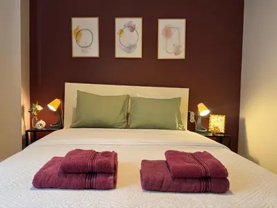 a bedroom with a bed with two towels on it at Stylish Apartment 3 Min to Metro in Istanbul