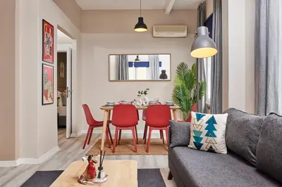 a living room with a couch and a table at 2BR Modern Flat in Nişantaşı 3 Min to Metro Full AC in Istanbul