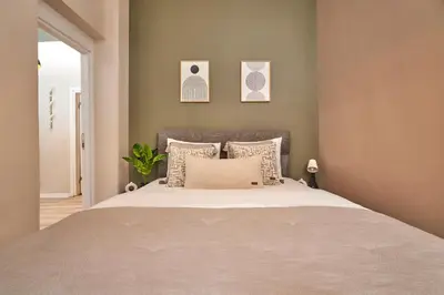 a bedroom with a large bed with pillows at 2BR Modern Flat in Nişantaşı 3 Min to Metro Full AC in Istanbul