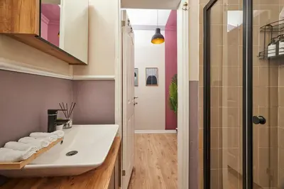 a bathroom with a sink and a shower at Comfortable 2BR Flat in Nişantaşı Near Metro in Istanbul