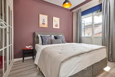 a bedroom with a large bed and a window at Modern 2BR in Nisantasi Area Balconies & AC in Istanbul