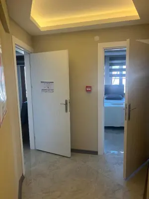 a room with a door and a room with a bed at rema house in Gemlik