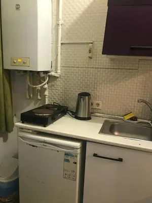 a kitchen with a sink and a counter top at Suite with a kitchen near istiklal street in Istanbul