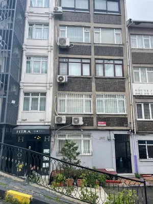 a tall building with windows on a city street at apart housee in Istanbul