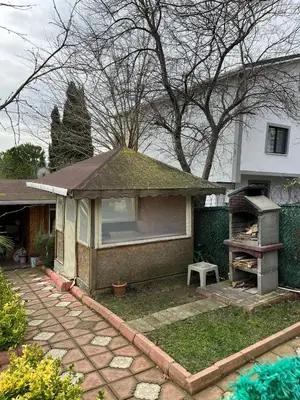 a house with a gazebo in the yard at Ciğ Bungalov Airport in Arnavutköy
